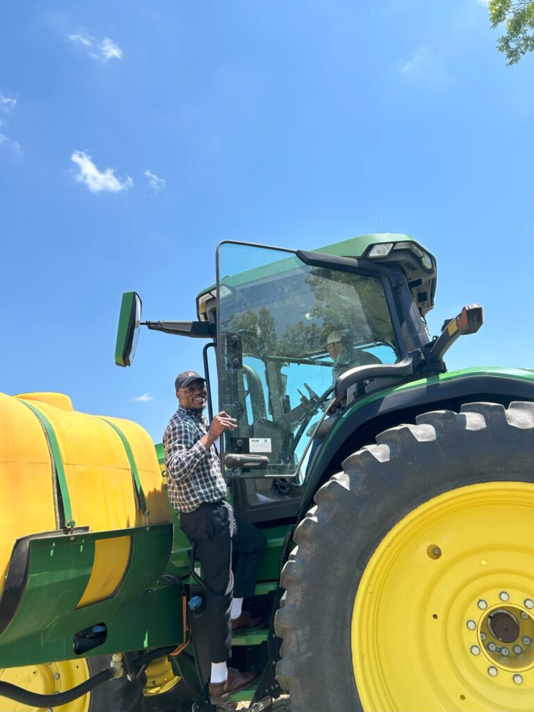 Joshua working a cotton planter