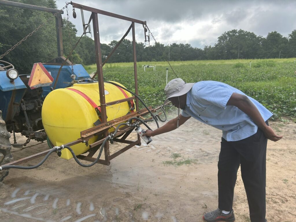 Joshua Calibrating Boom Sprayer